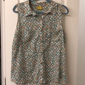 Sheer sleeveless button down top with cherry print